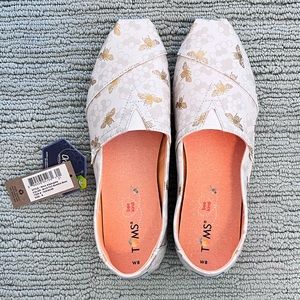 TOMS Women’s Classic Alpargatas in gold foil bee print